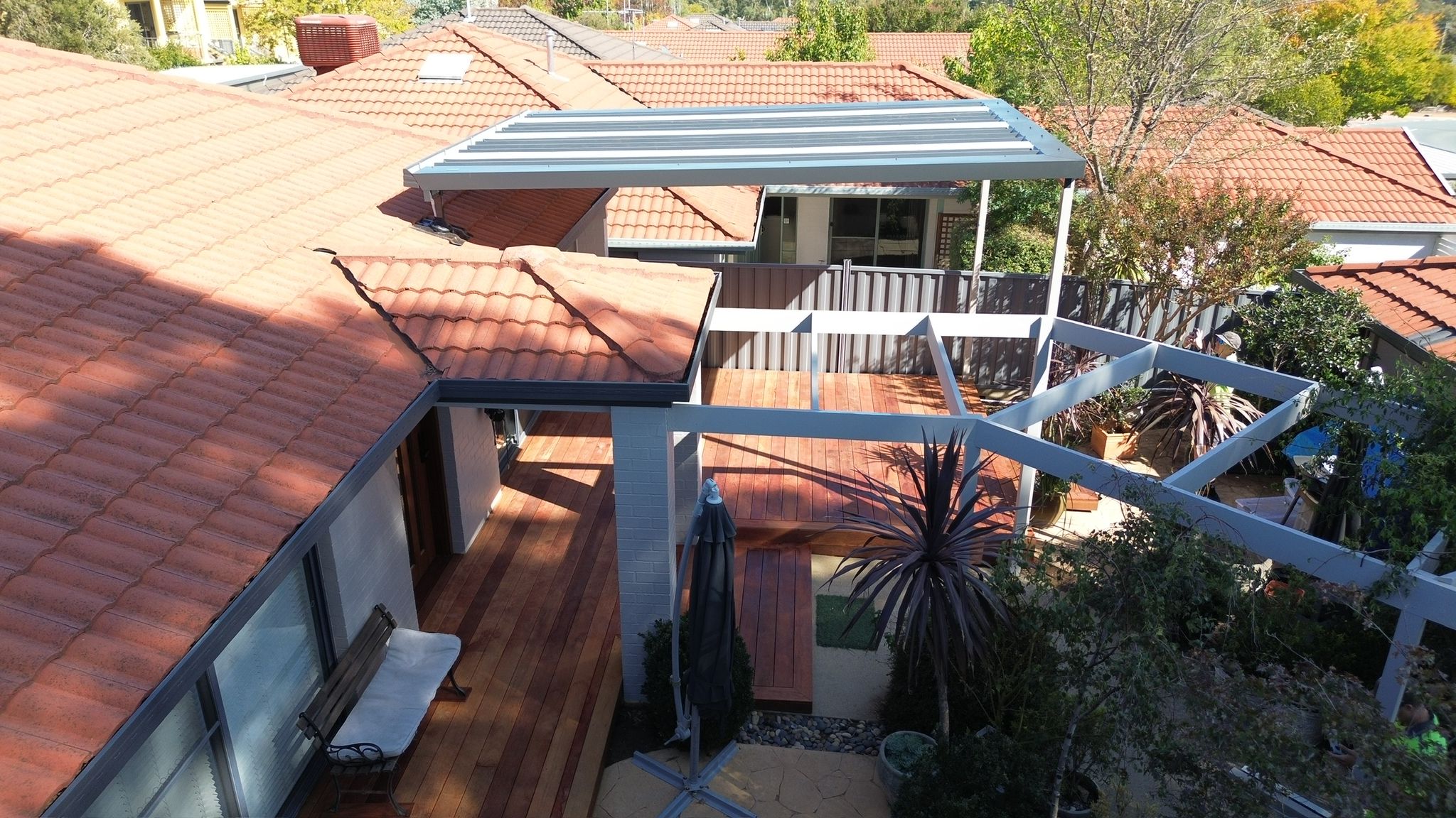 Pergola, carport and Merbau deck integrated on one property, Bruce Canberra, by BRT Building
