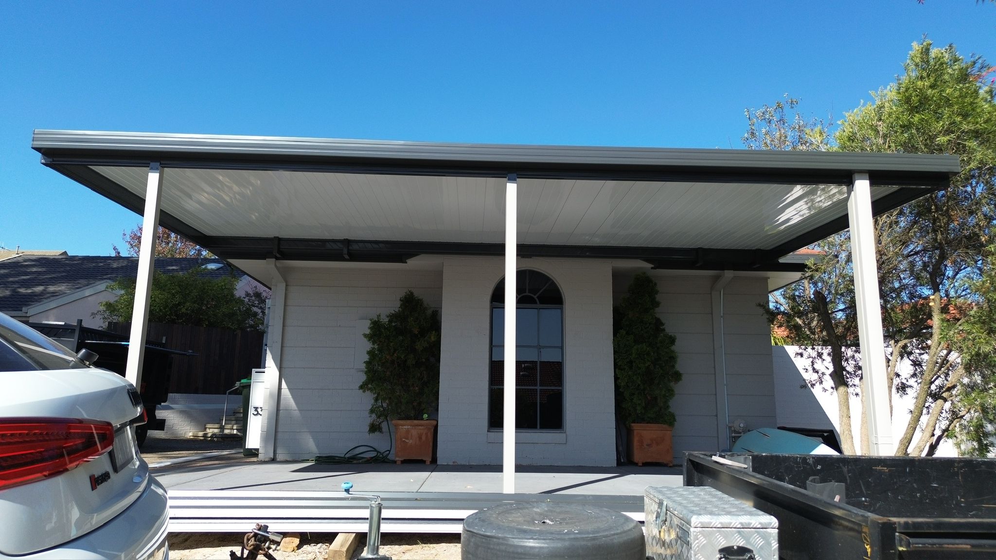 Ground-level view of multi-structure outdoor build with Merbau deck, Bruce Canberra