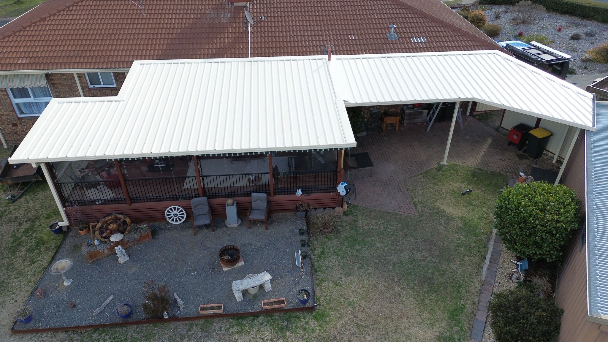 Aerial drone view of fascia-fixed pergola with insulated roof panel on riser brackets, Gowrie Canberra