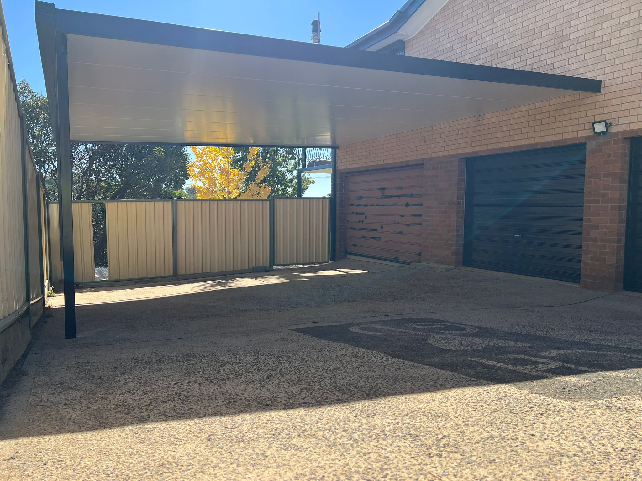 Carport with insulated roof panel attached to home, Latham Canberra