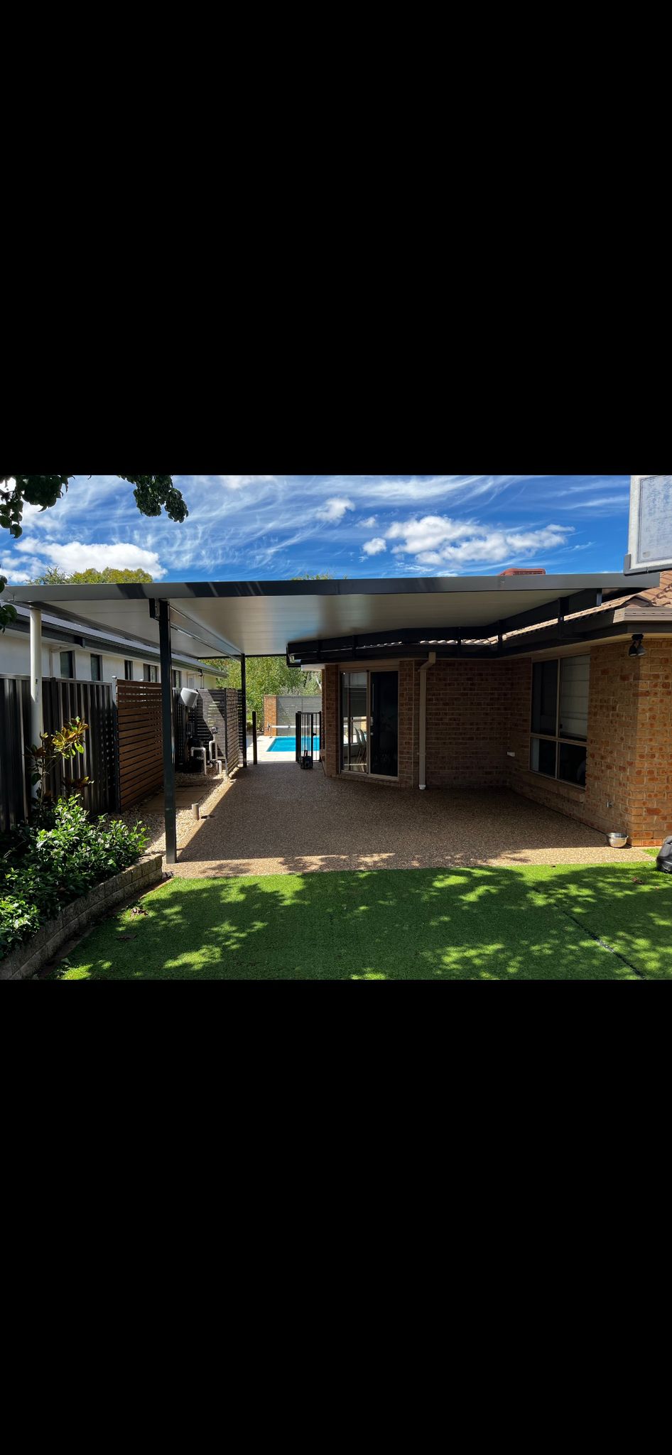 McKellar — pergola over composite deck beside pool